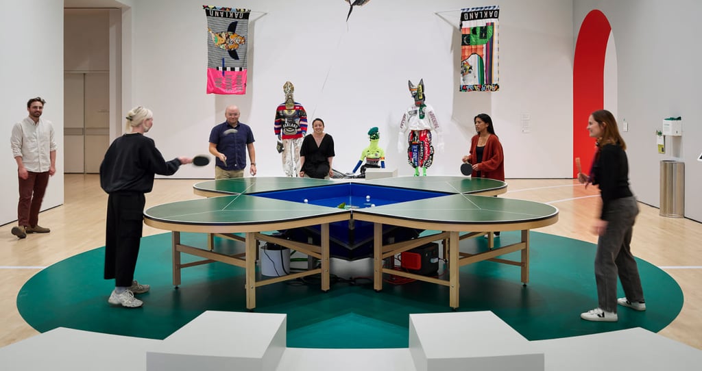 SFMoMA Get in the Game exhibition installation with colorful interactive sports-themed displays and visitors engaging with th