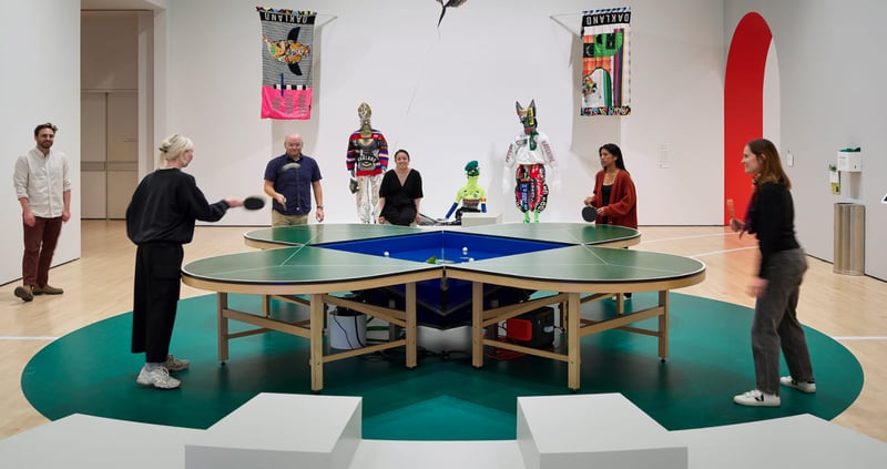 SFMoMA Get in the Game exhibition installation with colorful interactive sports-themed displays and visitors engaging with th