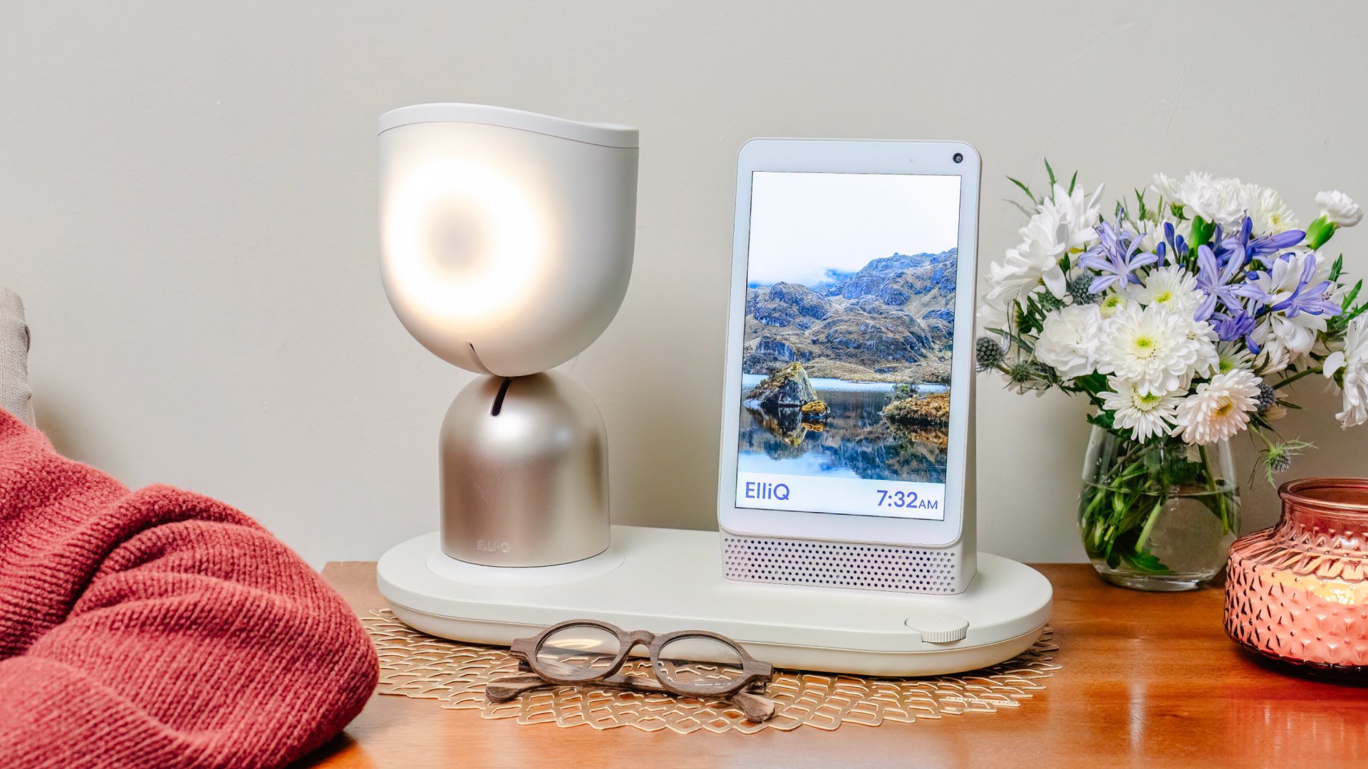 ElliQ companion robot on side table