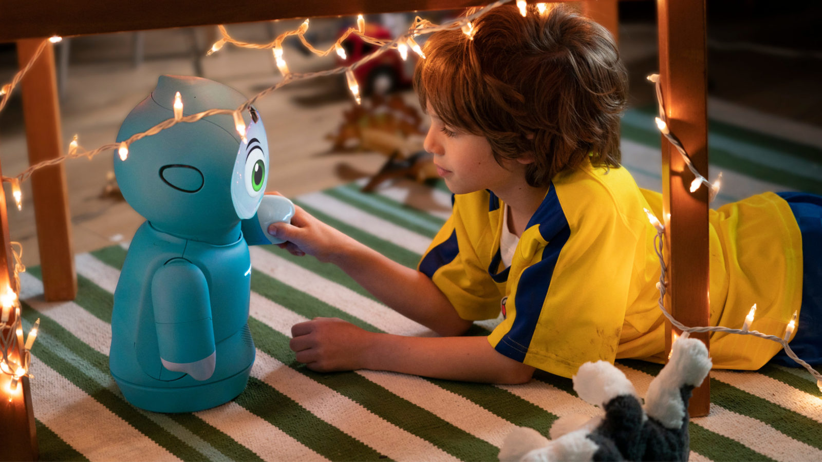 Embodied Moxie robot interacting with child