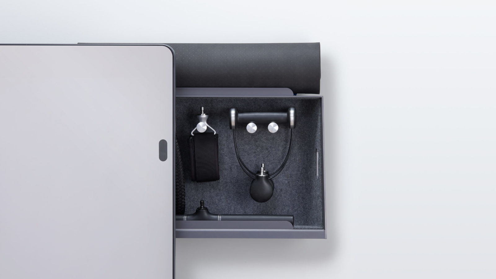 Forme Life smart fitness mirror with open accessory drawer revealing weighted handles and resistance equipment