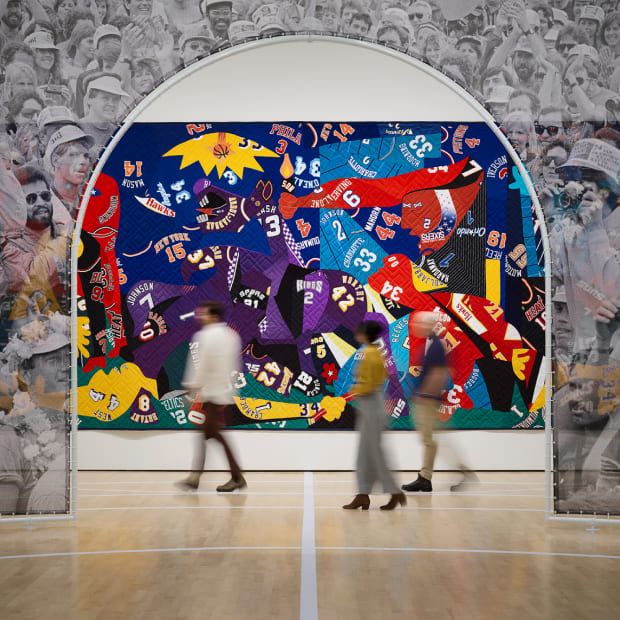 Gray and navy art gallery with quilt-like sports jersey display