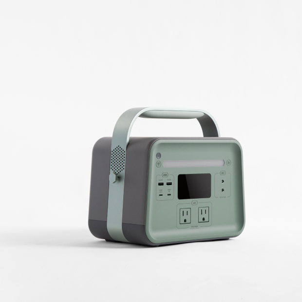 Green portable power station with digital display on a white background