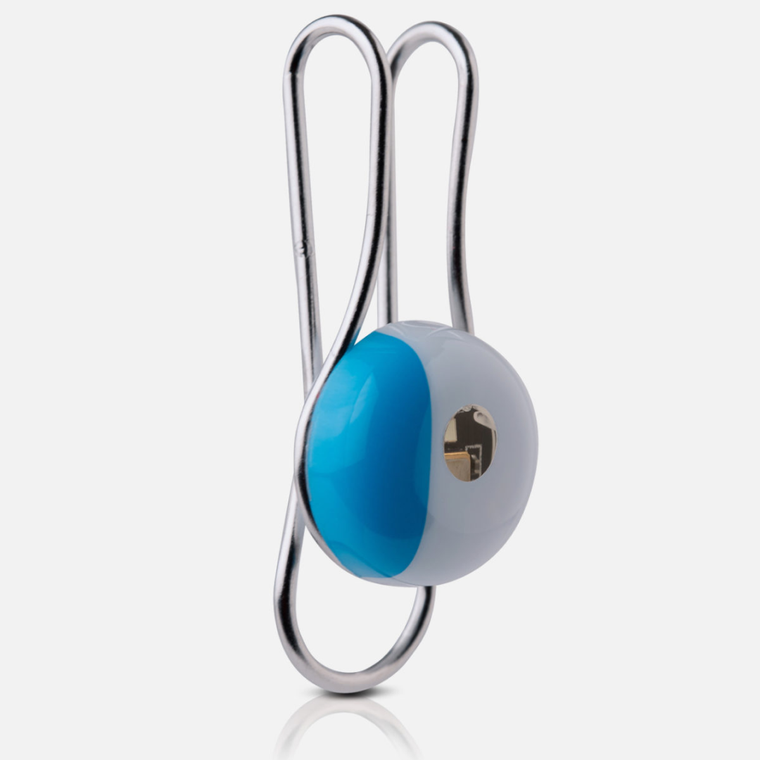 Silver ring with blue stone and gold ring connected by chain