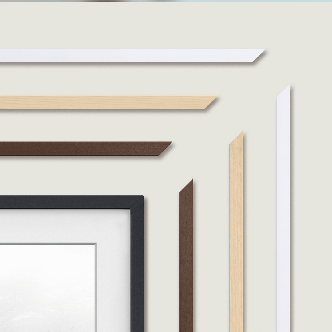 Collection of framed photographs in a grid pattern on a plain background