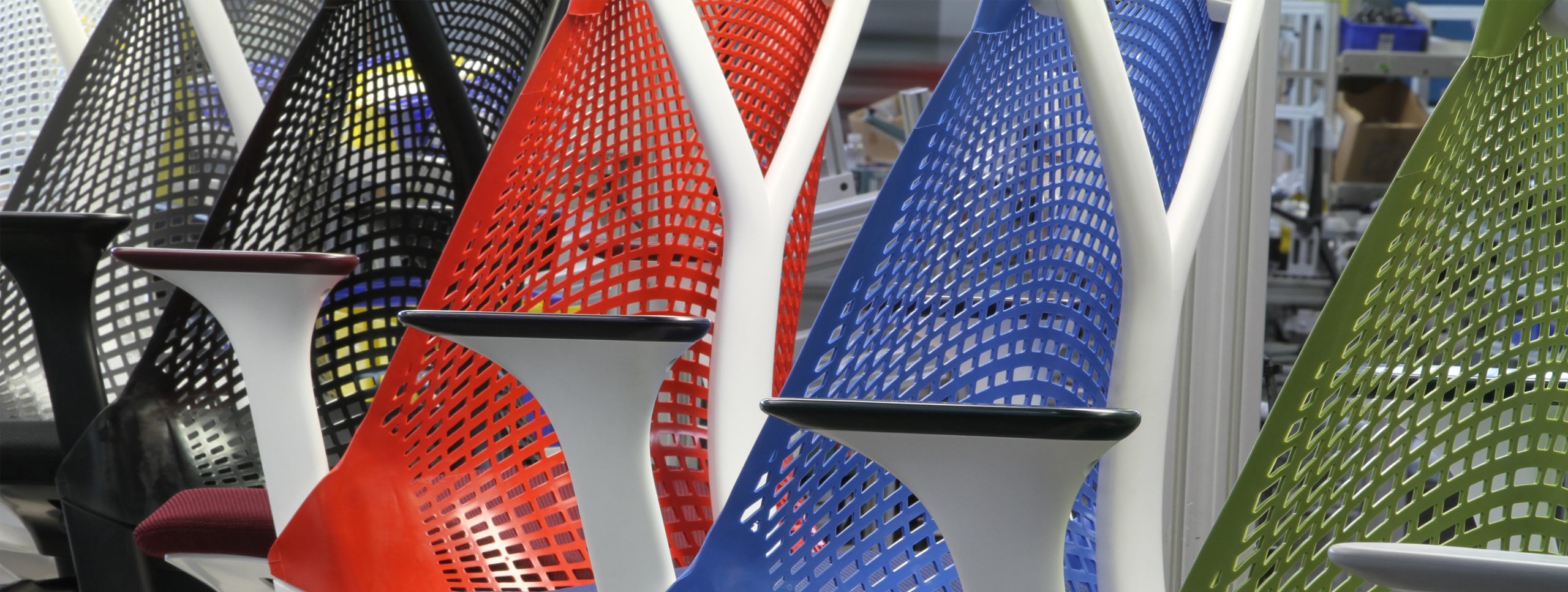 Herman Miller Sayl chairs in colorful row