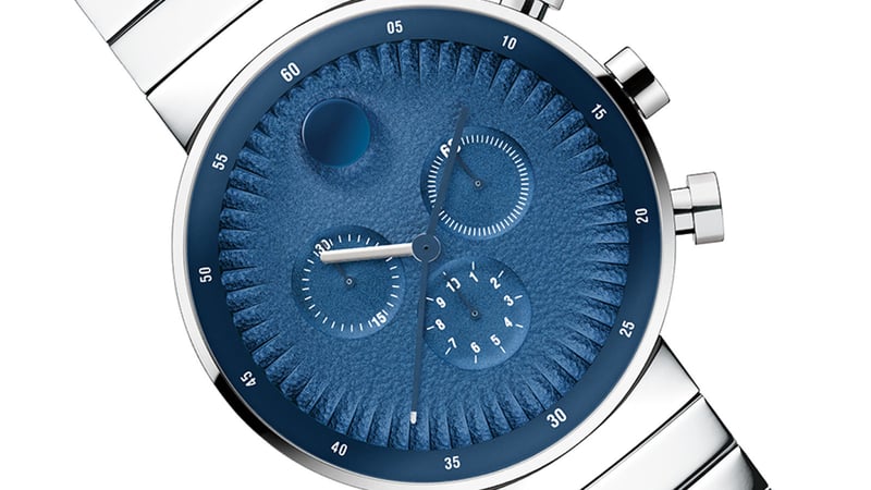 Blue-faced watch with silver band and date function