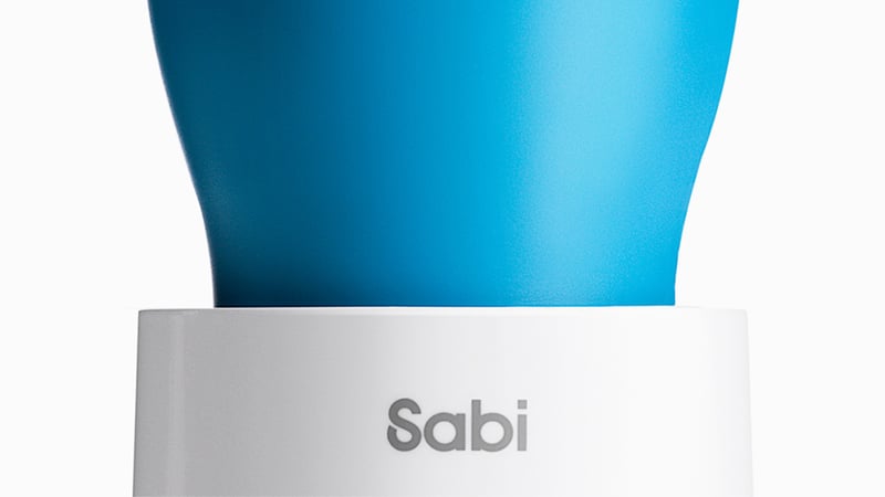 Blue and white cup with 'SABI' printed on it