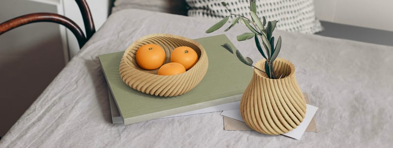 Vine basket with oranges and plant
