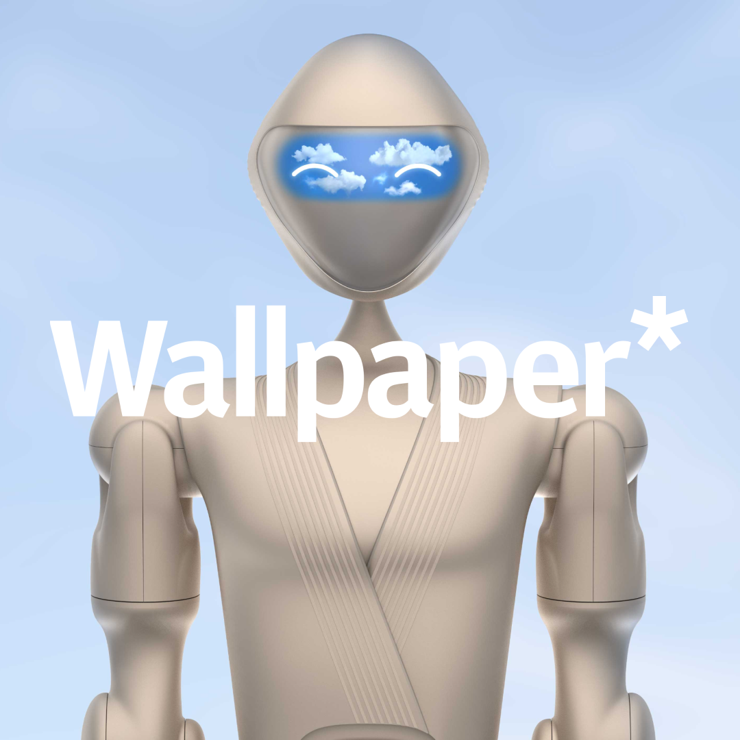 White robot with blue screen eyes and silver body against a clear sky