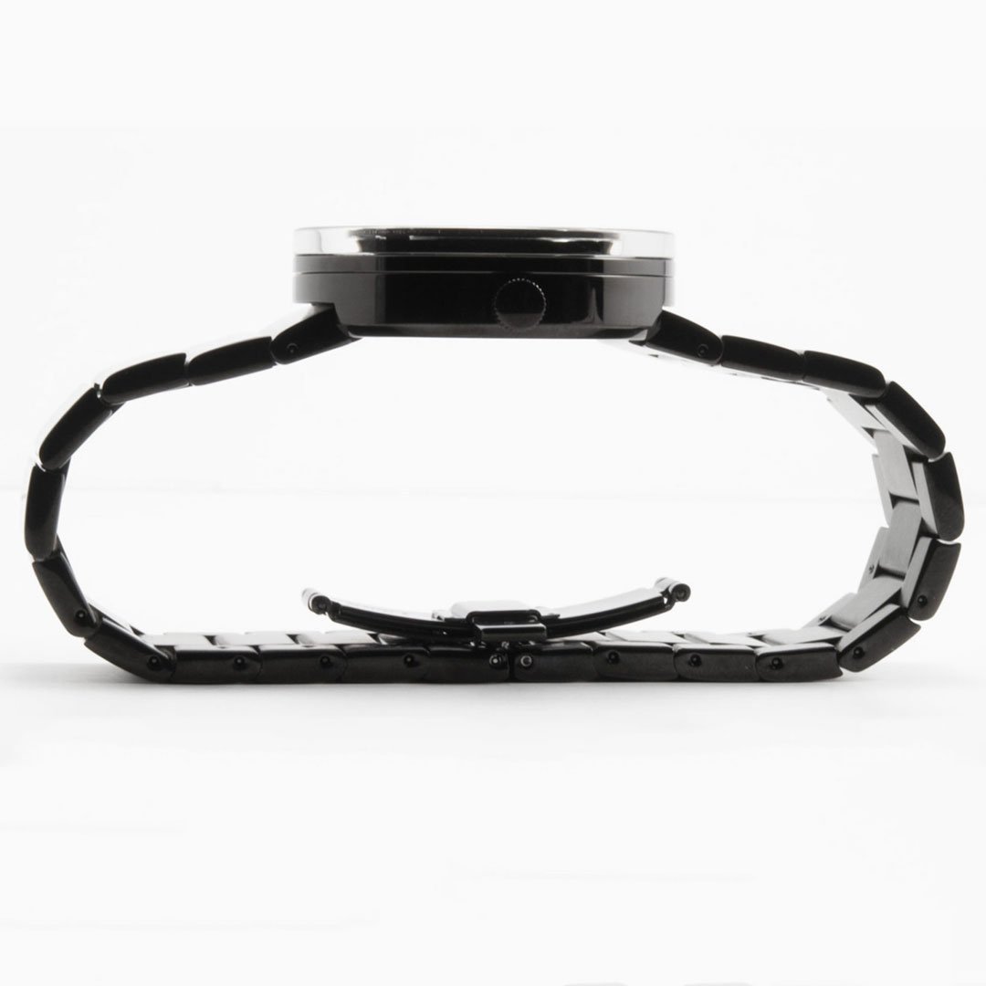 Side profile view of Issey Miyake VUE watch showcasing the slim black ceramic case and open-clasped link bracelet