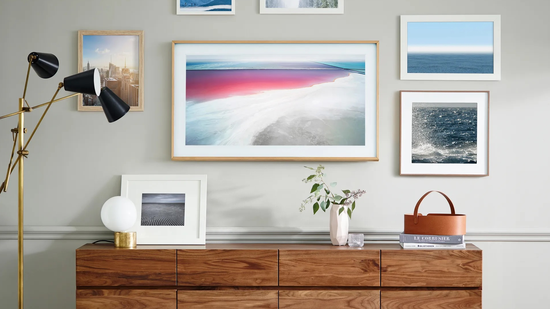 Beige living room with wall art featuring red sky and blue water