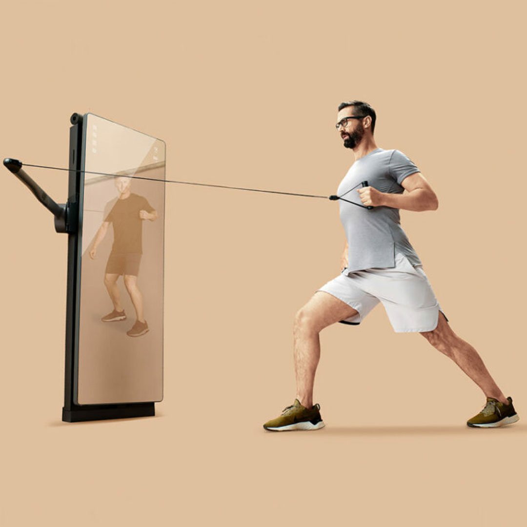 Man in athletic attire pulling a weight machine with both hands