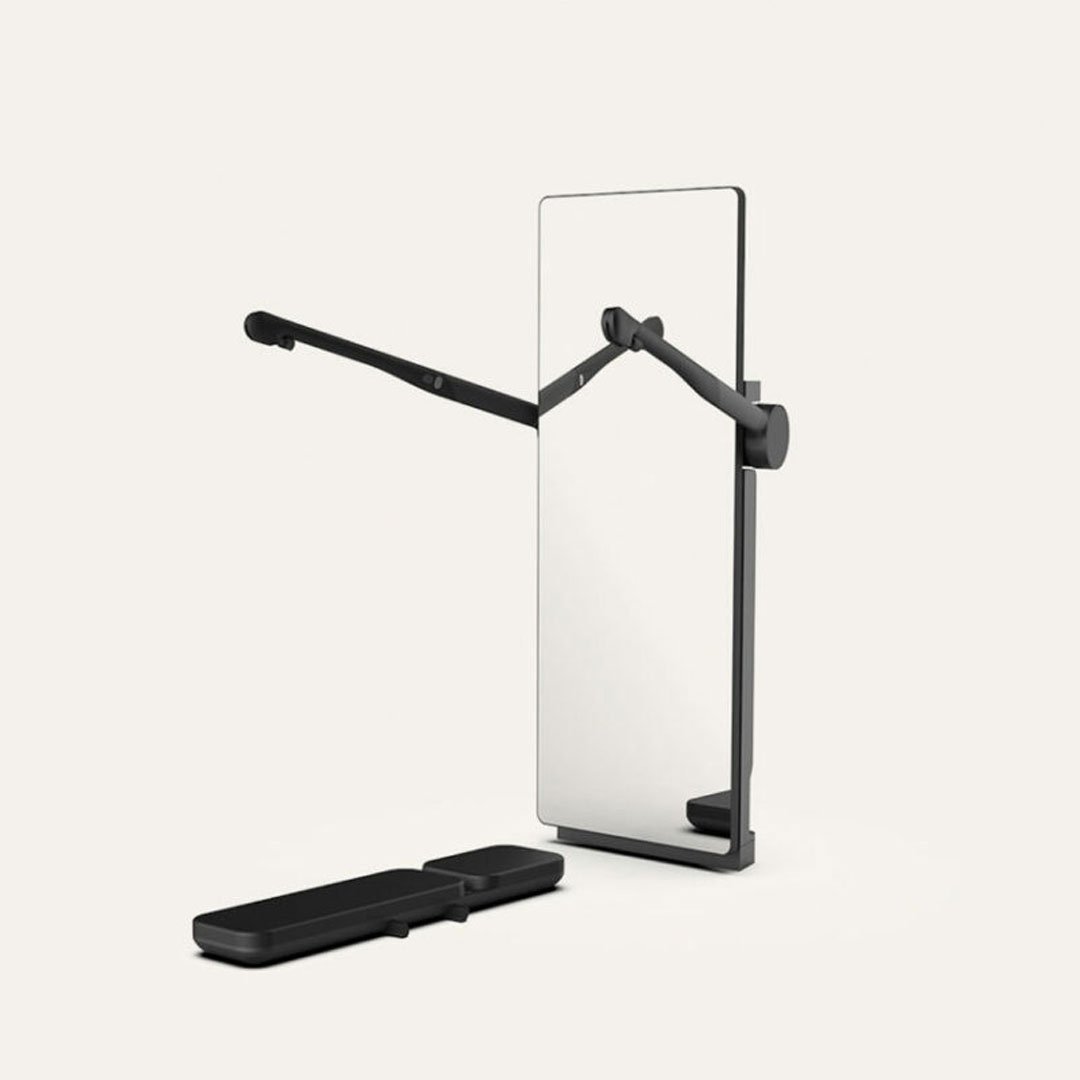 Black frame wall mirror with clear glass panel and phone stand