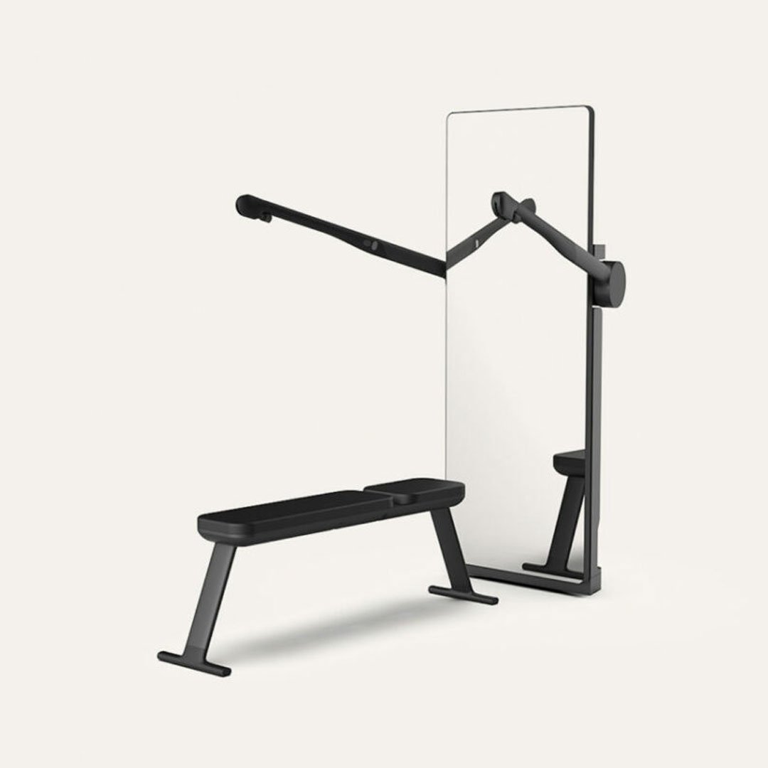 Black weight bench with mirror and pull-up bar in a minimalist home gym