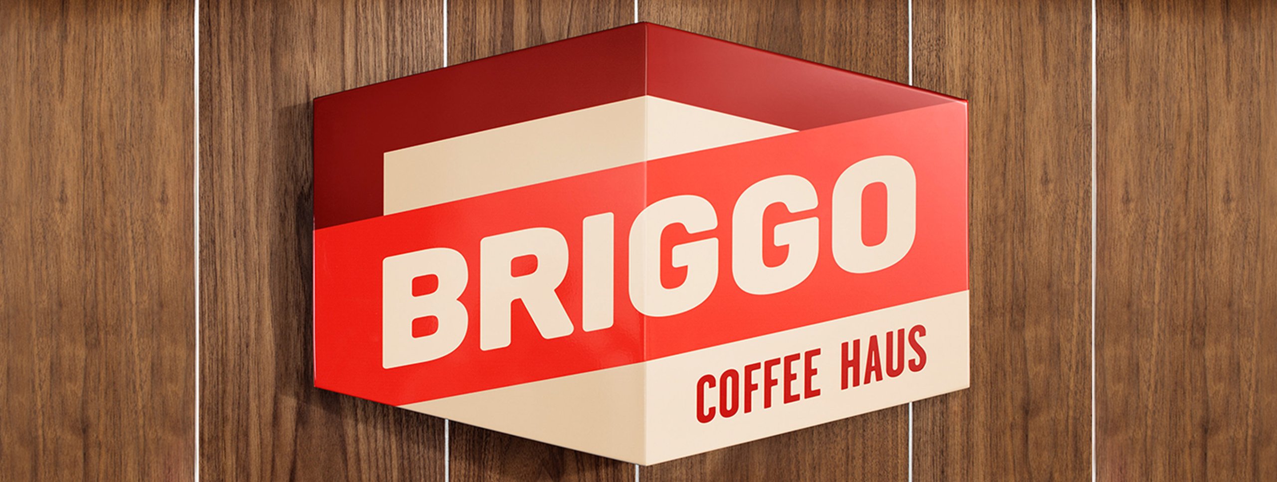 Red sign with white letters reading 'Brixton Coffee Houses' against a red background