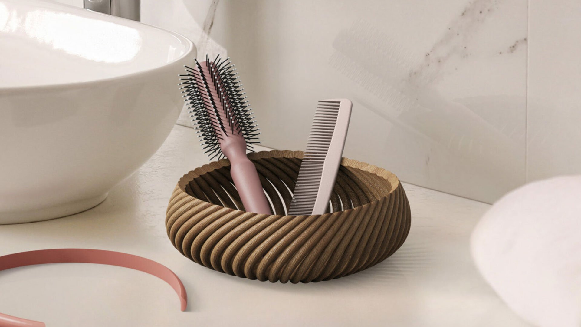 Wooden bowl with toothbrushes and scissors on a marble countertop