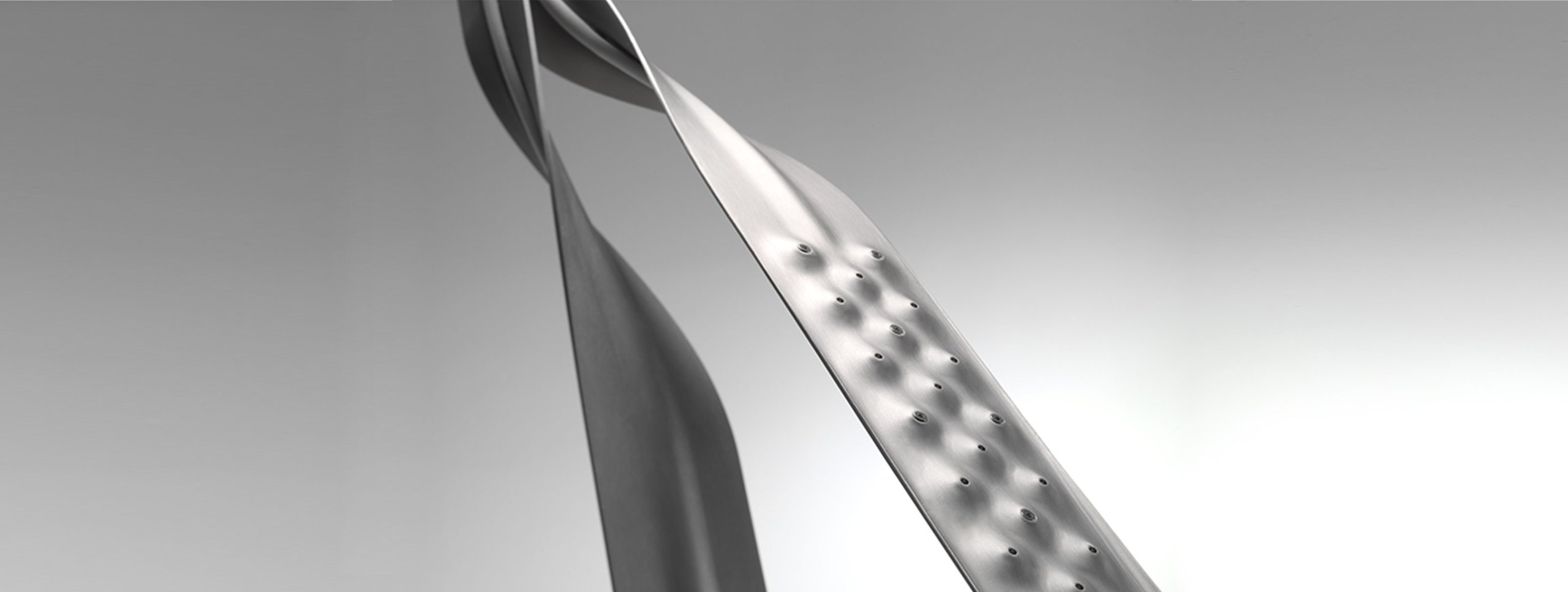 Herman Miller Leaf Lamp with cylindrical metallic shade and ridged indentations