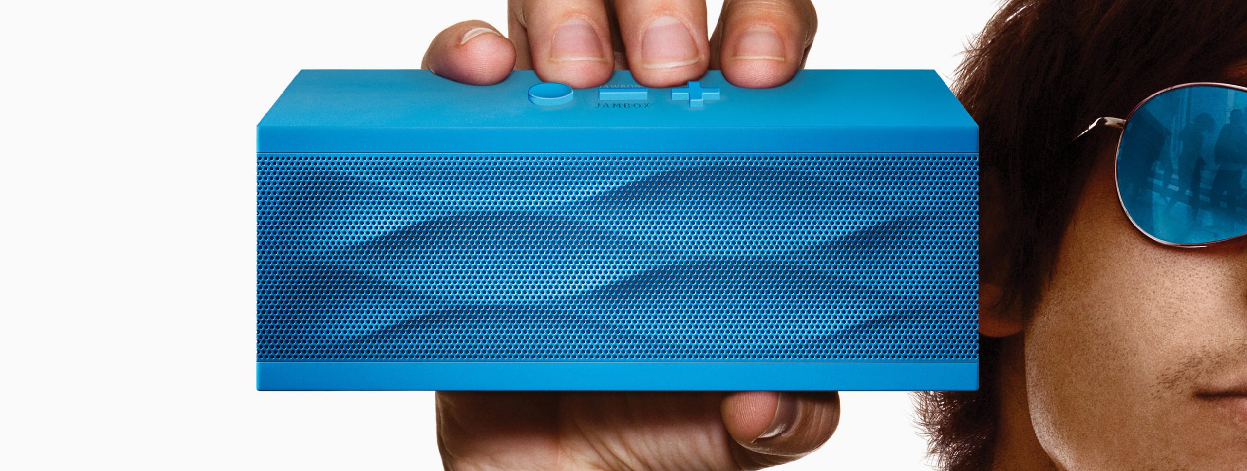 Blue boombox with a person holding it