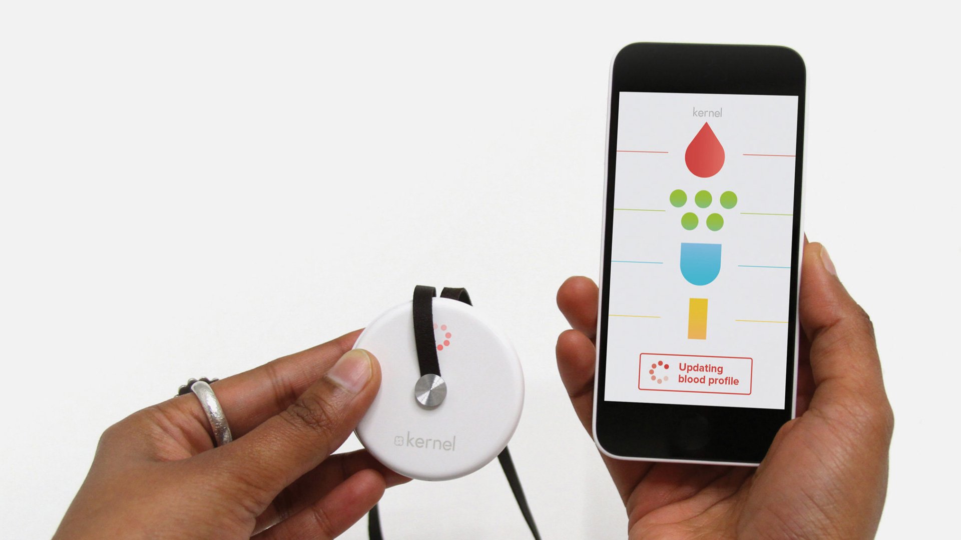 Person holding smartphone with health app and blood pressure monitor