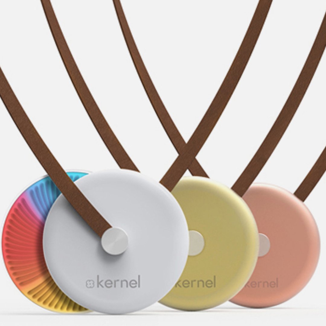 Kernel collection of six colorful health monitor pendants with brown leather straps in a row