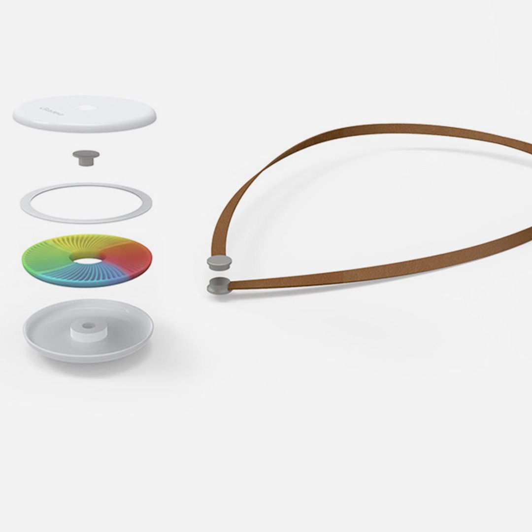 Kernel circular wearable health monitor pendants in various colors arranged on white background