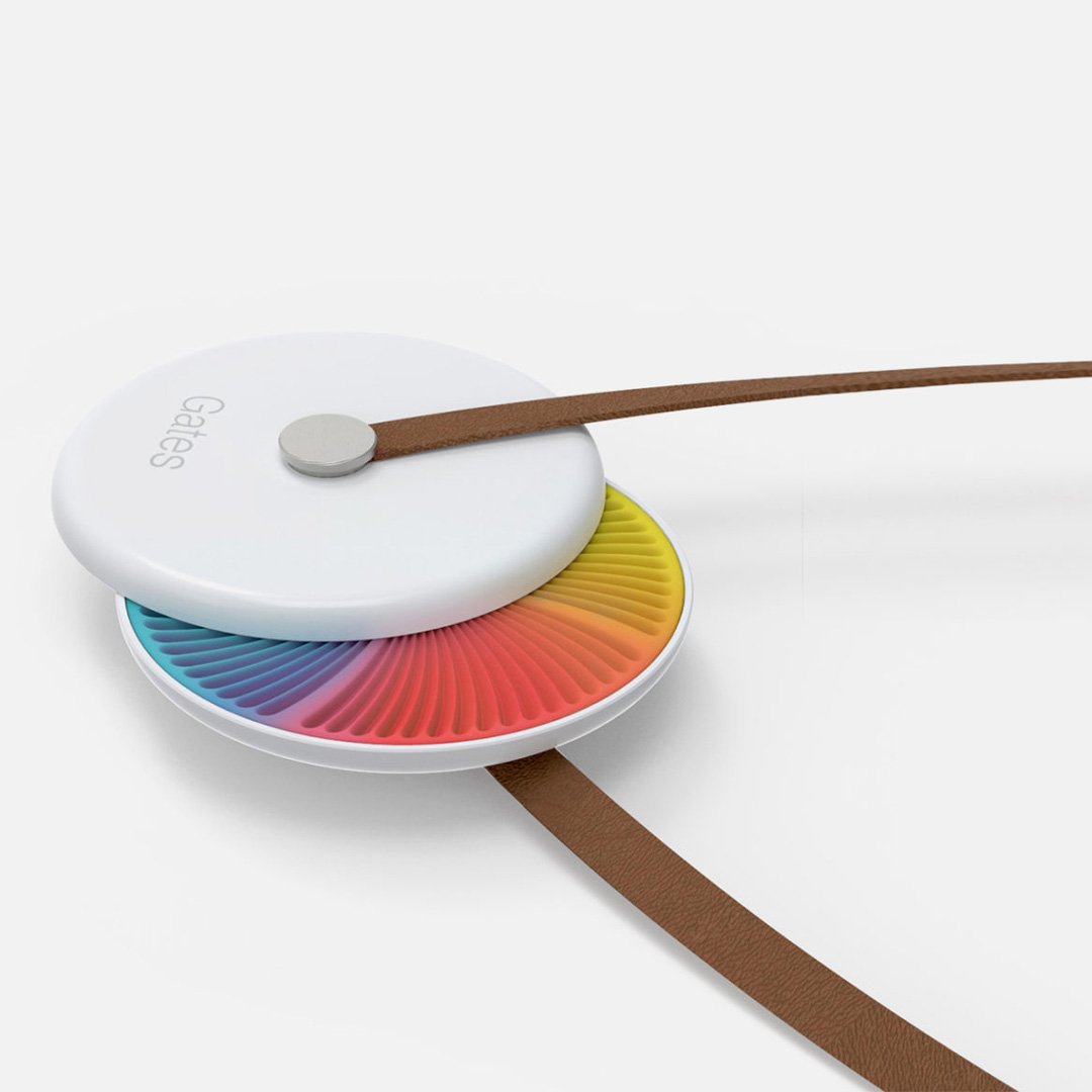 Kernel smartwatch with rainbow gradient watch face and brown leather strap on white background