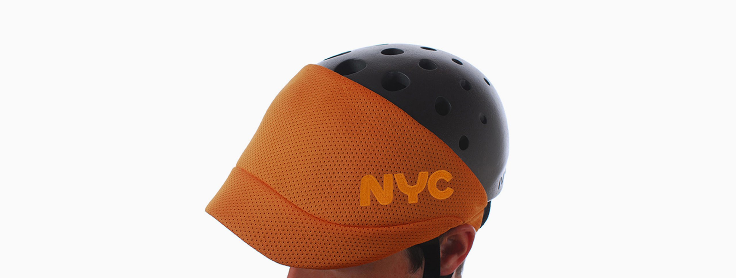 NYC Helmet case study: orange beanie with black NYC lettering on a plain background