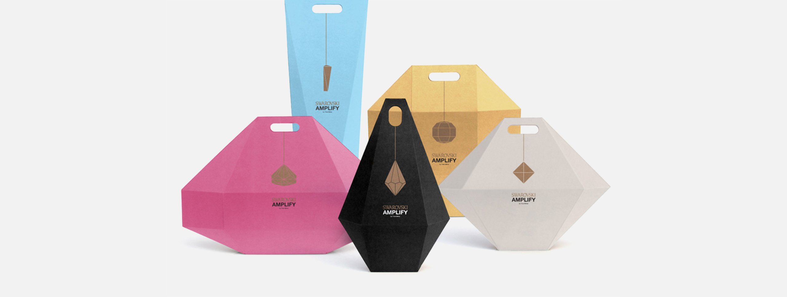 Three product packages with unique color schemes in a row