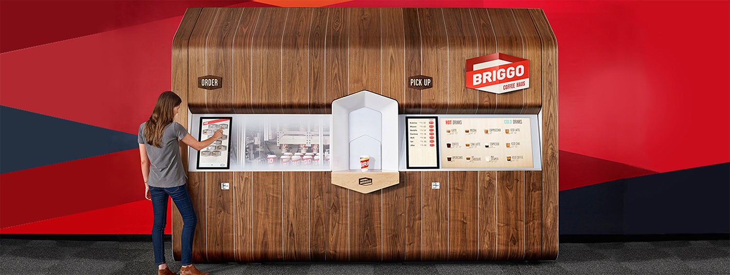 Customer at Biggo coffee wooden kiosk display