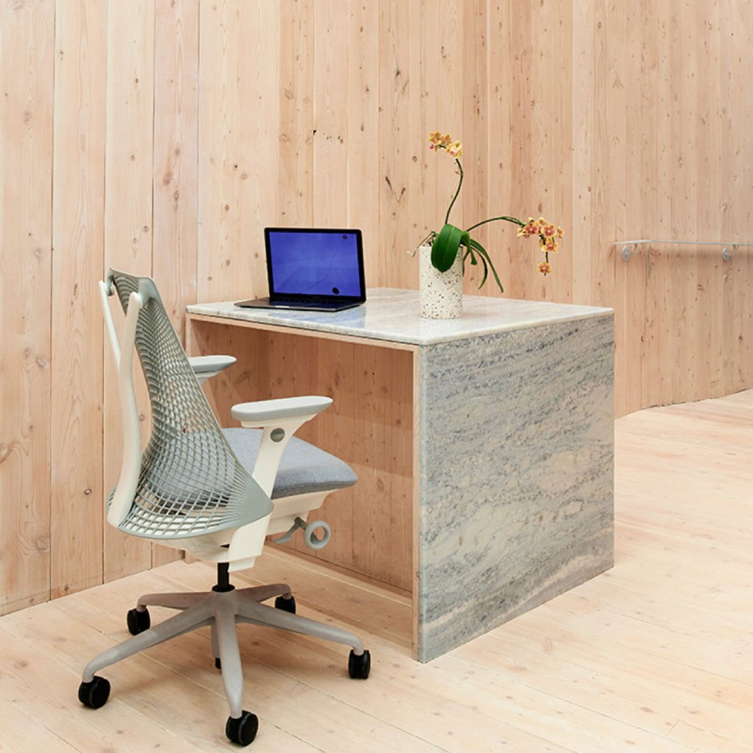 Canopy coworking workspace with wood paneling