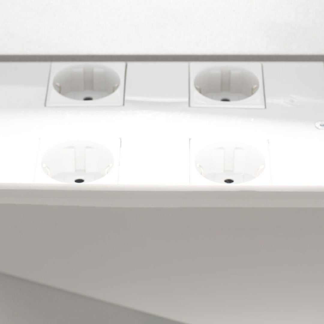 White electrical outlet with gold contacts and four slots