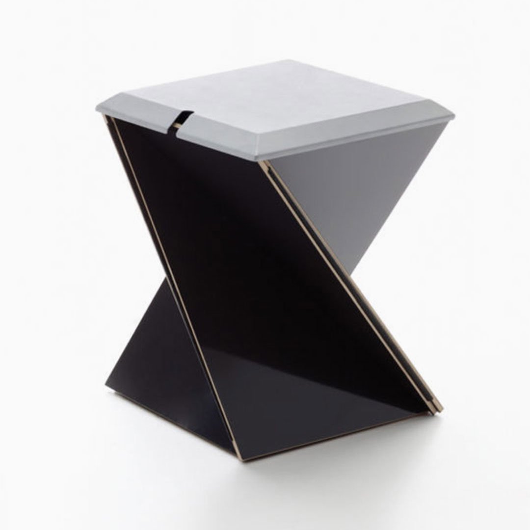 Black side table with square top and rectangular base against a white background