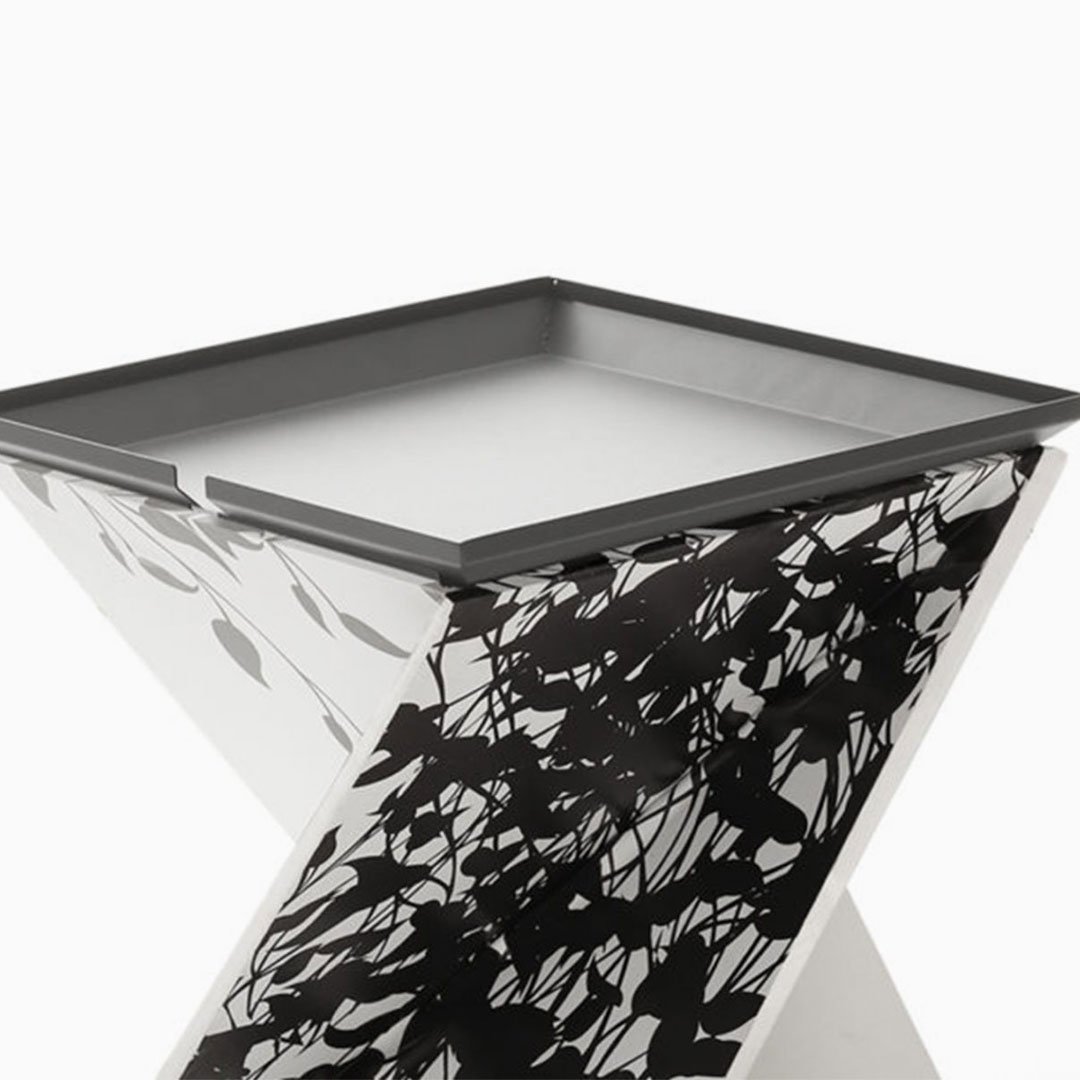 Two minimalist tables with black and white marble-like surfaces
