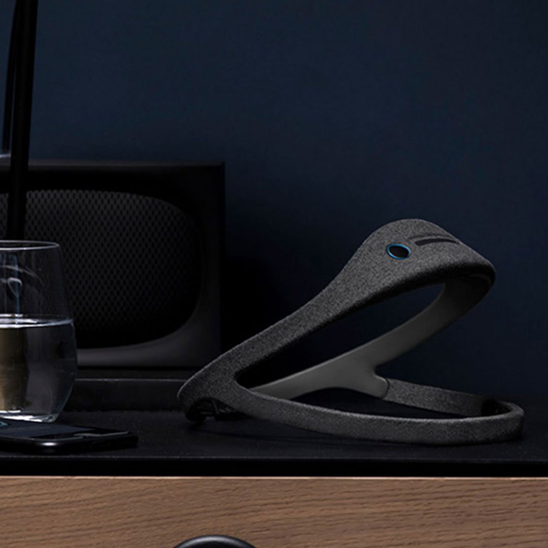 Dreem sleep headband on desk with phone
