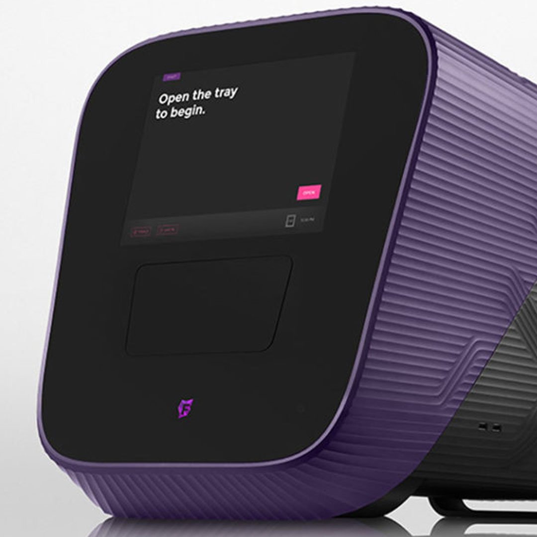 Fluidigm purple and black analyzer displaying open the tray to begin message on white background