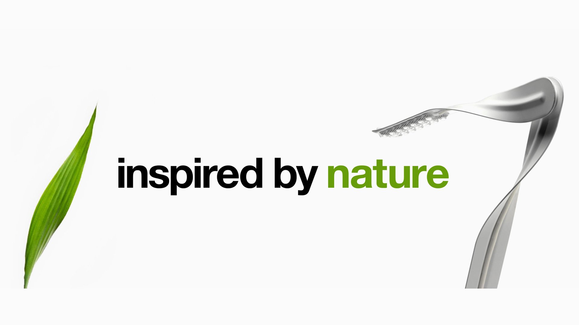 Herman Miller Leaf LED task lamp by Yves Behar - sleek silver flexible blade-shaped fixture with leaf and "inspired by nature