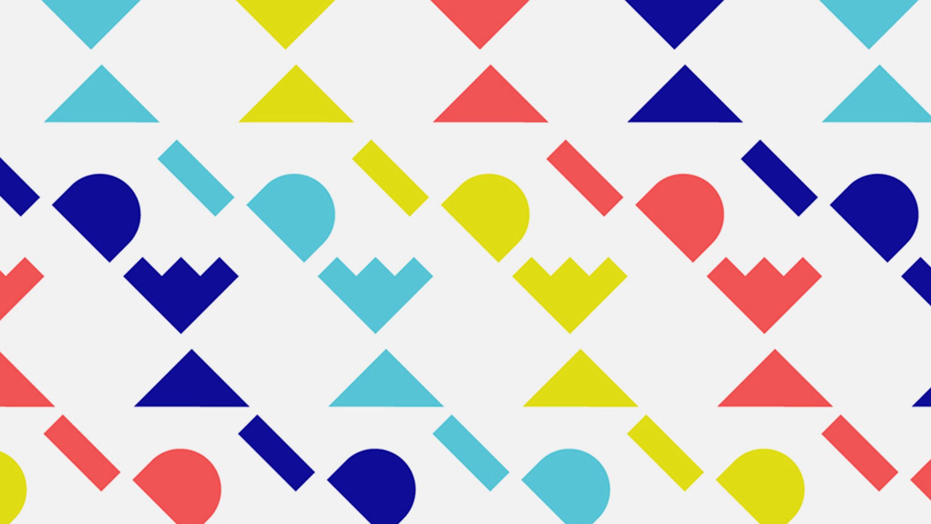 IDSA IDEA branded pattern of blue, yellow and red geometric digital shapes on white background