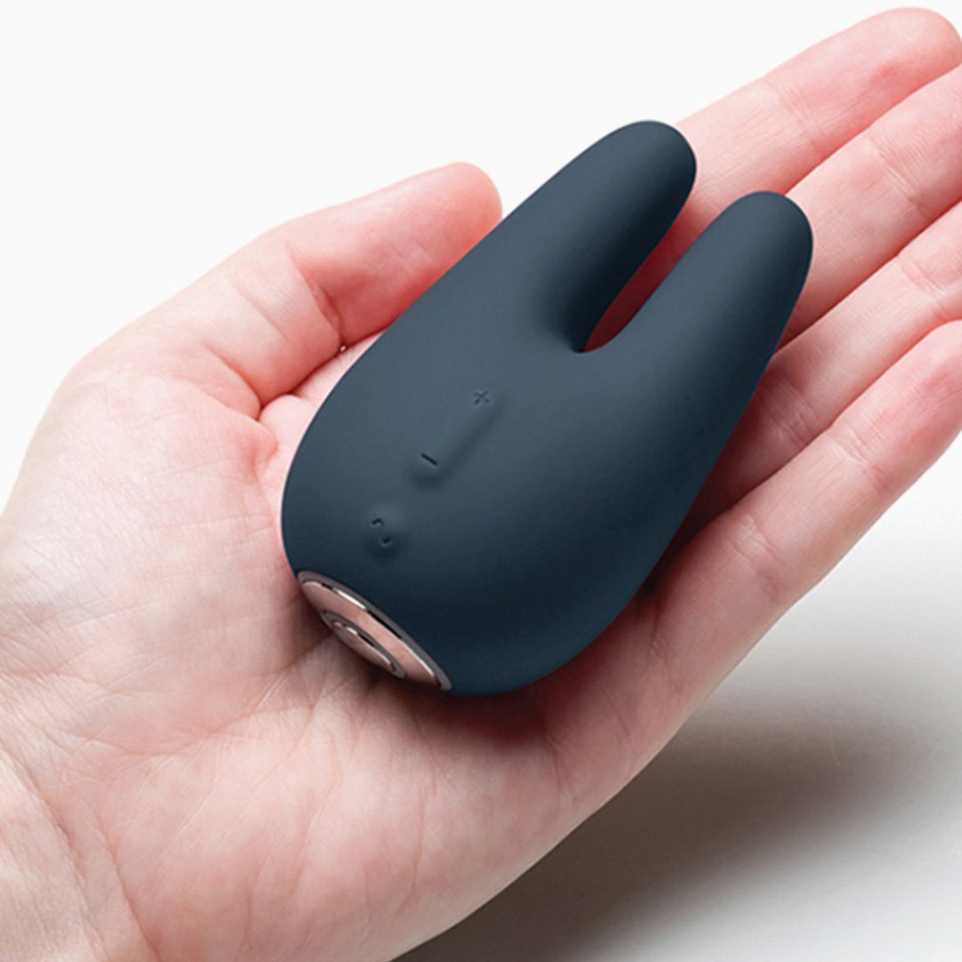 Jimmy Jane Form 2 product in close-up and wider hand-held views with black accent