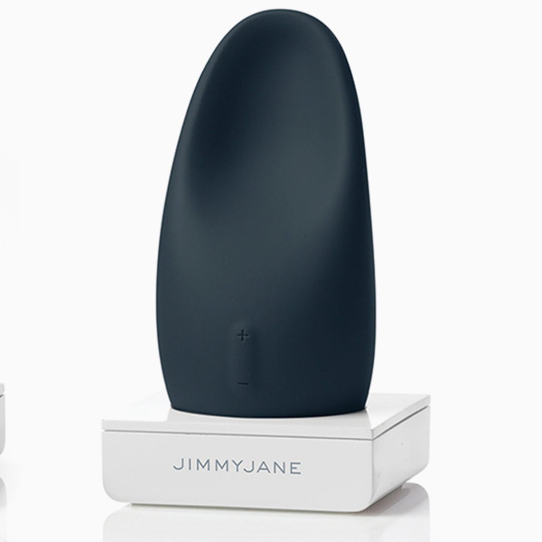 Blue and black vibrator on a white surface