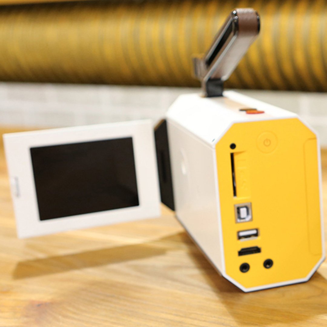 Yellow and white camera on a surface