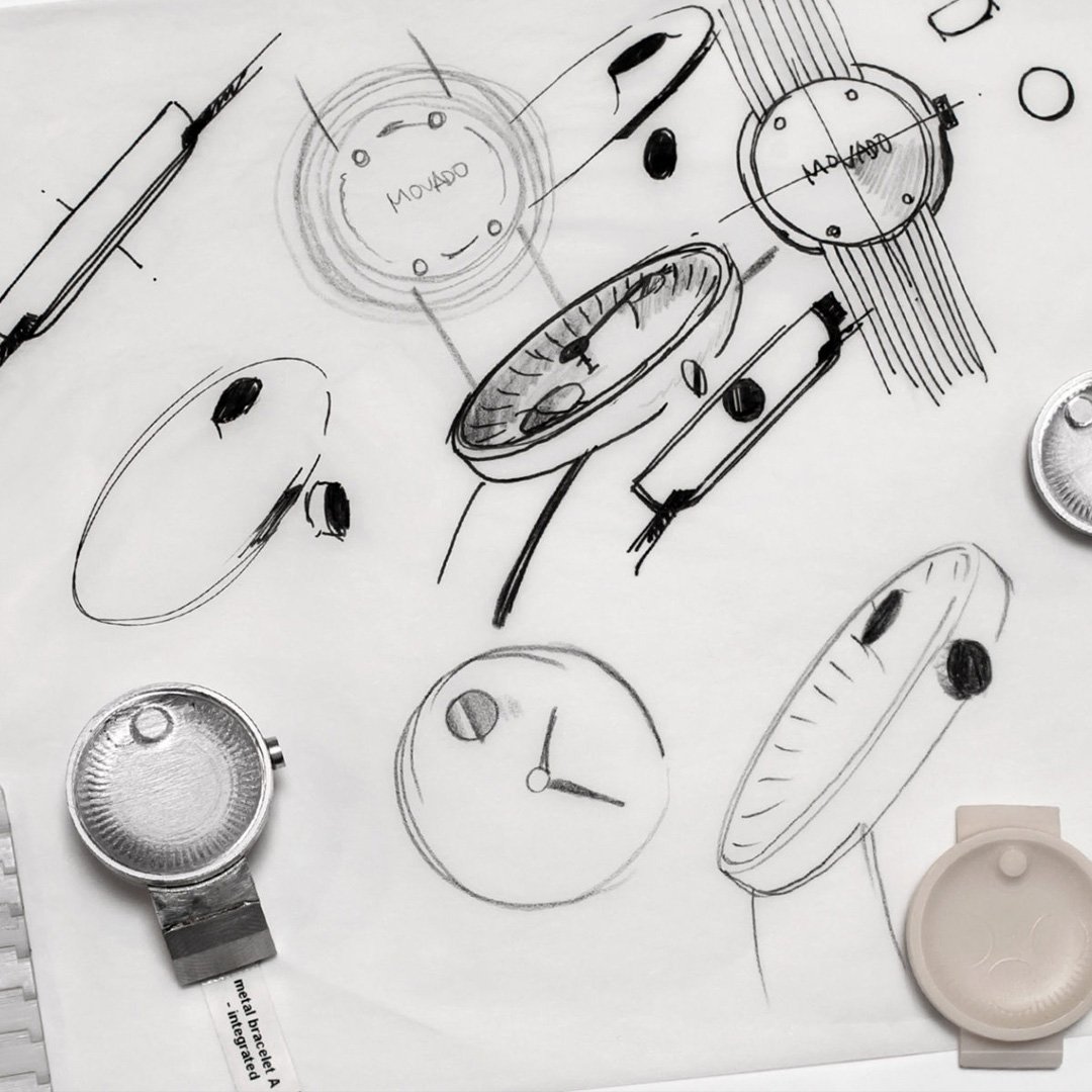 Movado Edge black and white design sketches of watch parts and clocks on paper