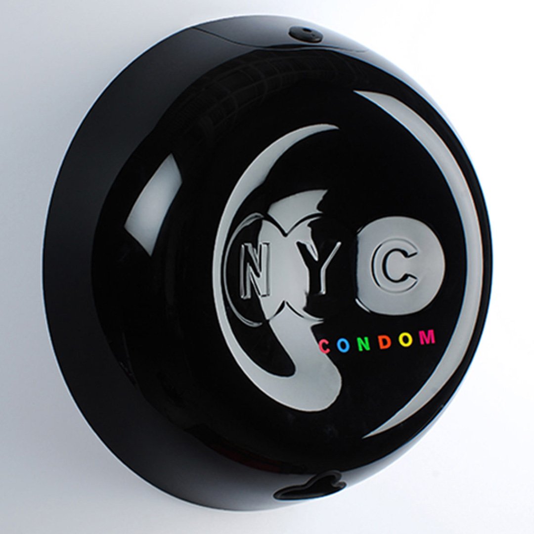Black round object with white stylized heart logo and 'NYC' text