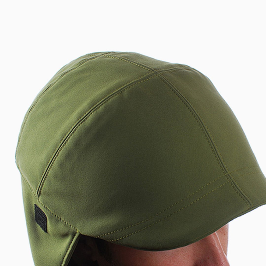 NYC Helmet green soft textured fabric cover with brim pulled down obscuring the face