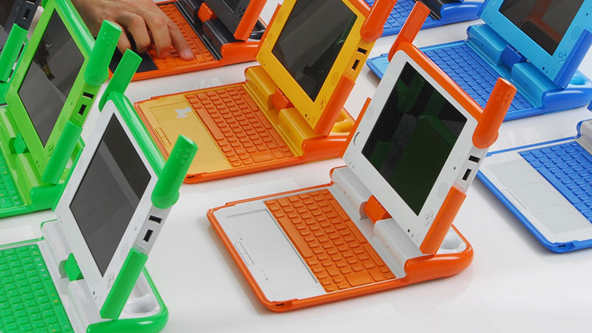 Colorful laptop keyboards in a grid on a white surface