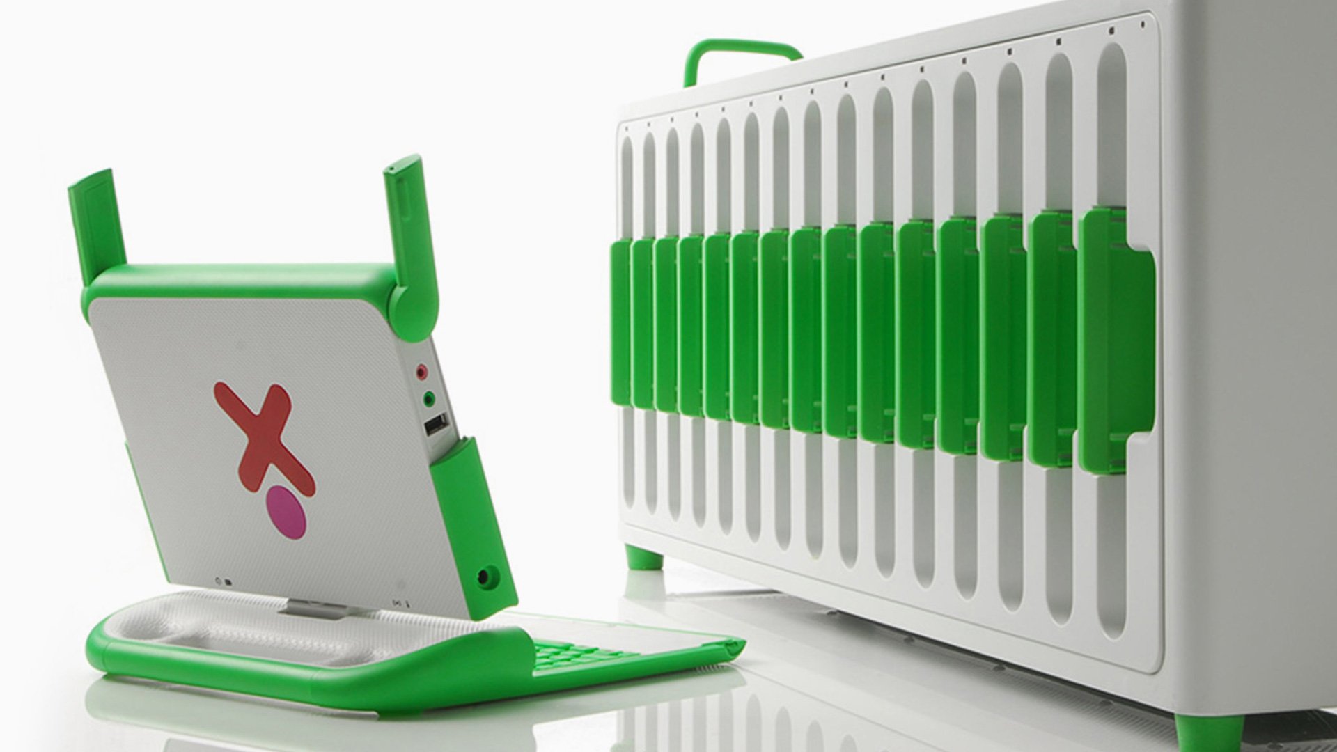White and green electronic devices with red cross screens on handles