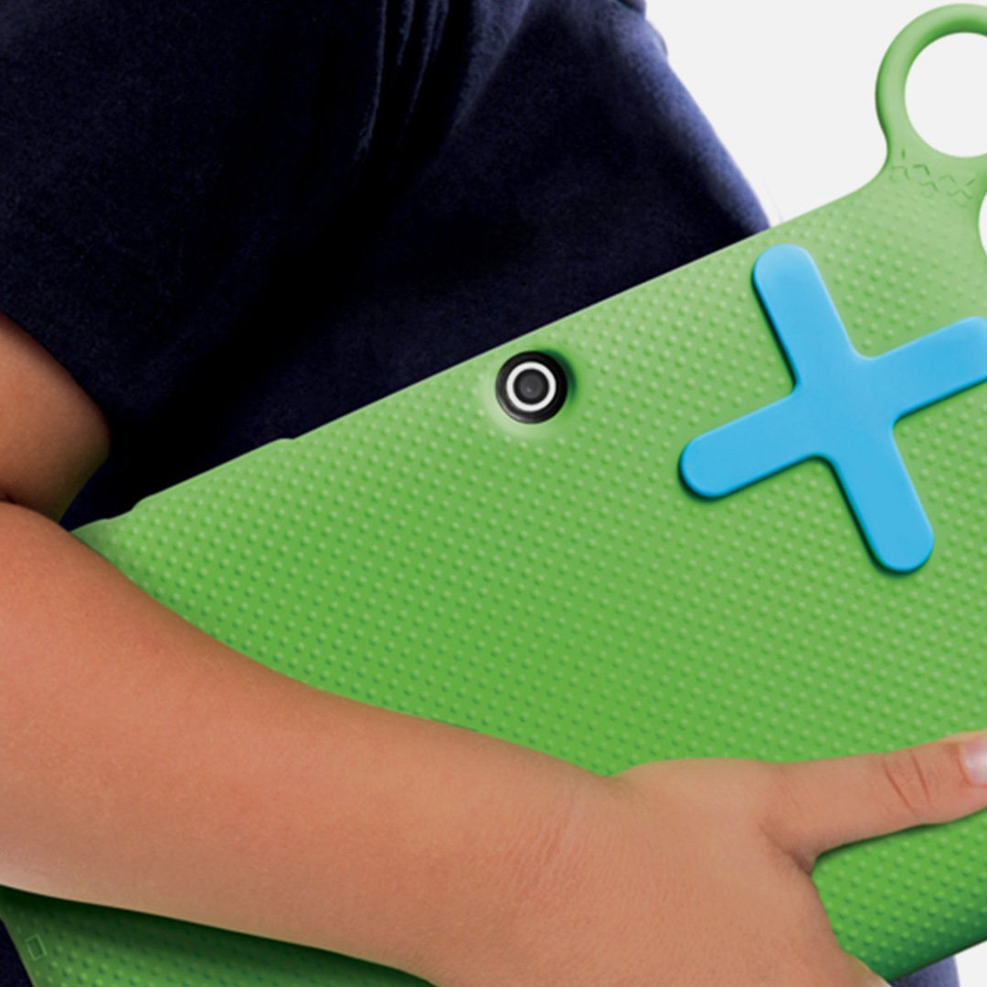 Child holding a green wallet-like object with a plus sign in two photos