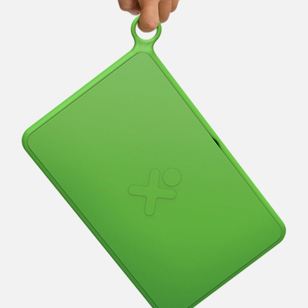 OLPC XO Tablet prototype with green clipboard-style housing displaying the white OLPC logo