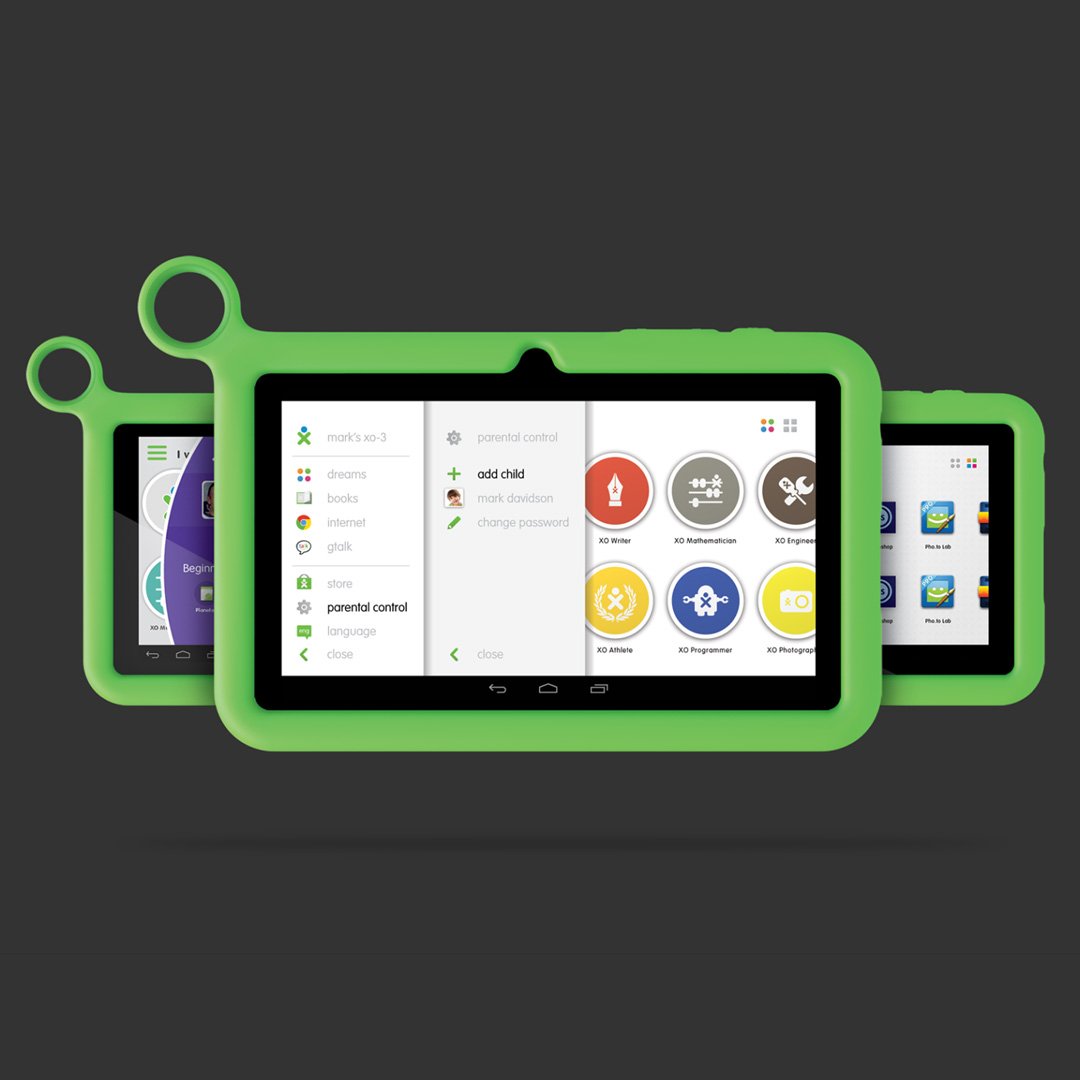 Two green devices with black screens and colorful interfaces on a dark background