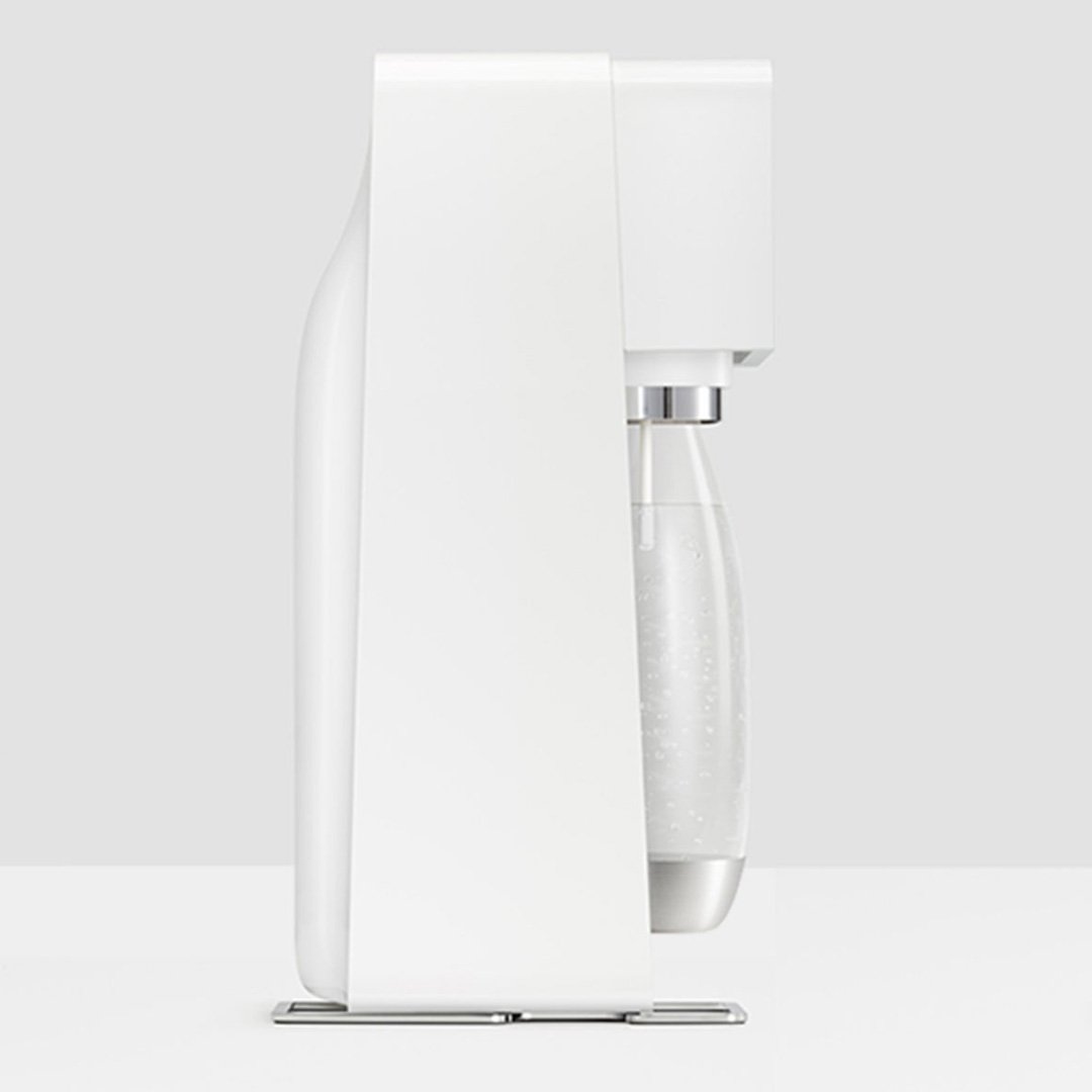 White coffee maker with clear glass carafe and digital display